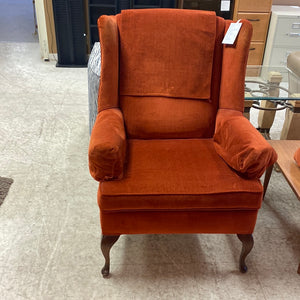 Burnt orange wingback chair