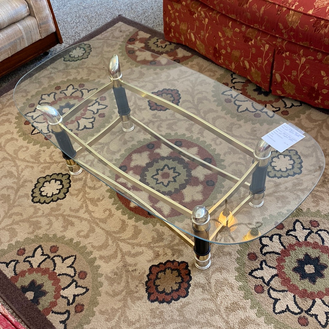 Glass top golden coffee table