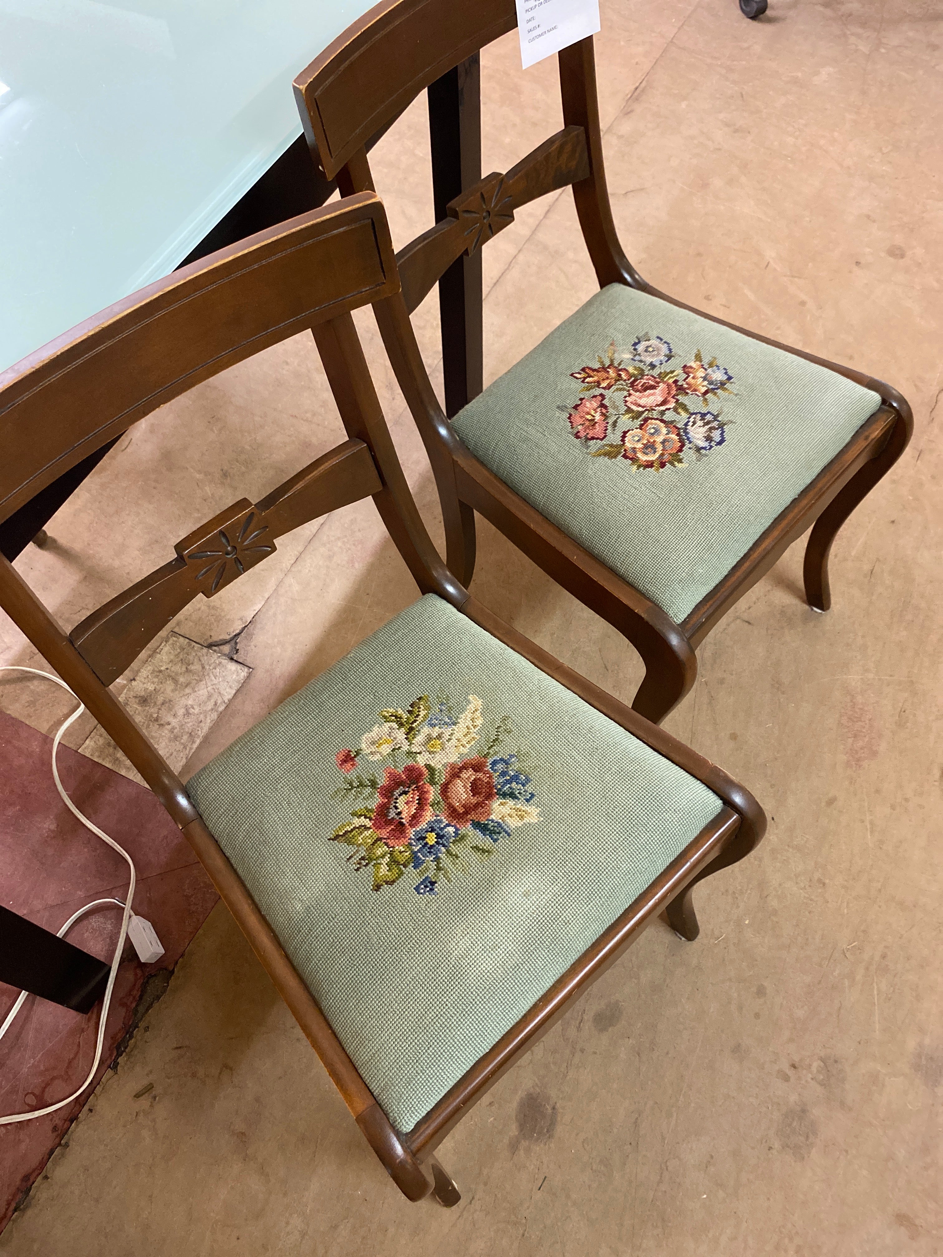 2 green needle point chairs