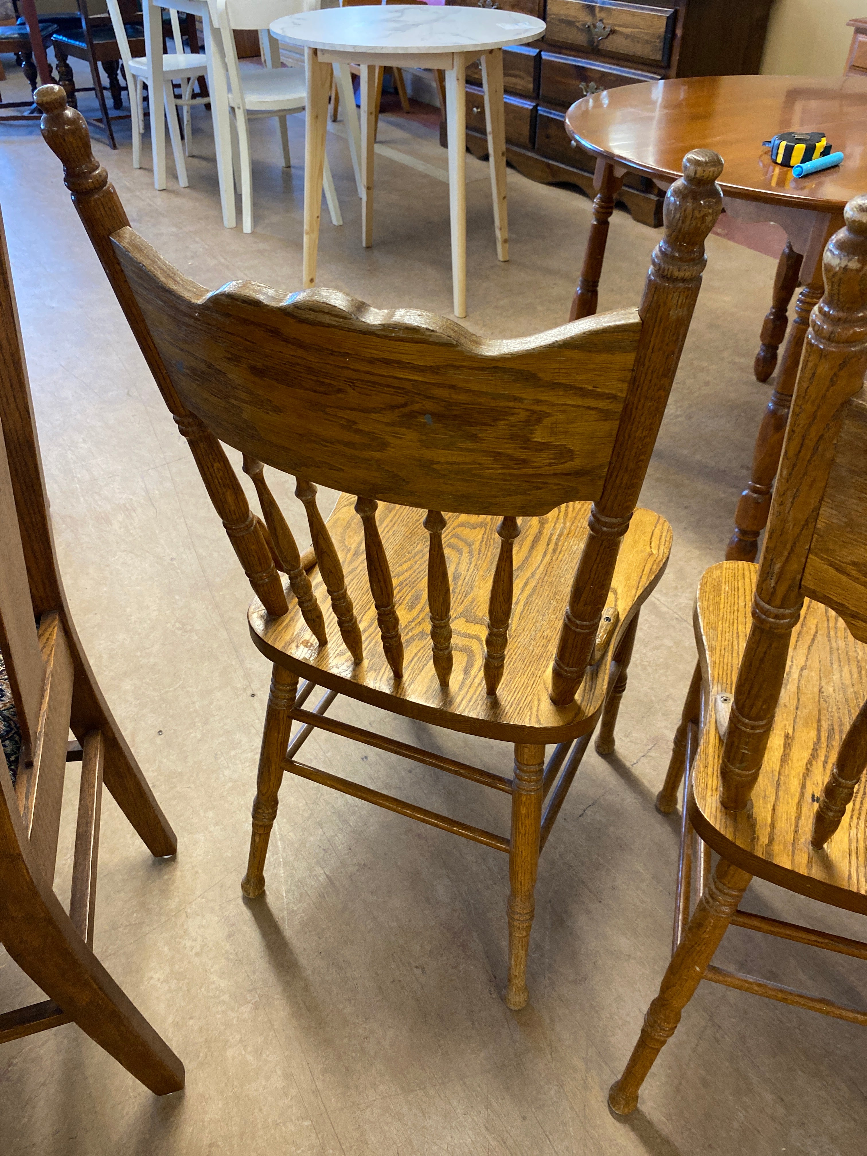 2 pressed back wooden chairs