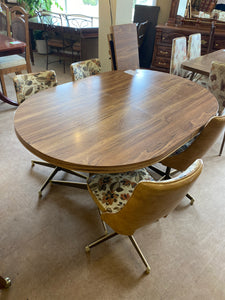 4 swivel chairs table and 2 leaves