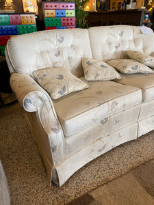 Curvy white loveseat