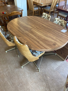 4 swivel chairs table and 2 leaves