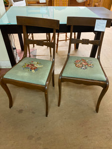 2 green needle point chairs