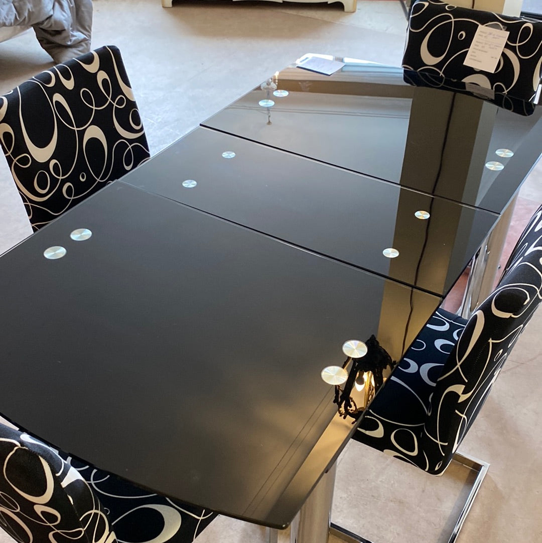 Black glass top table with hidden leaf