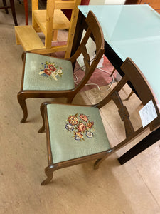 2 green needle point chairs