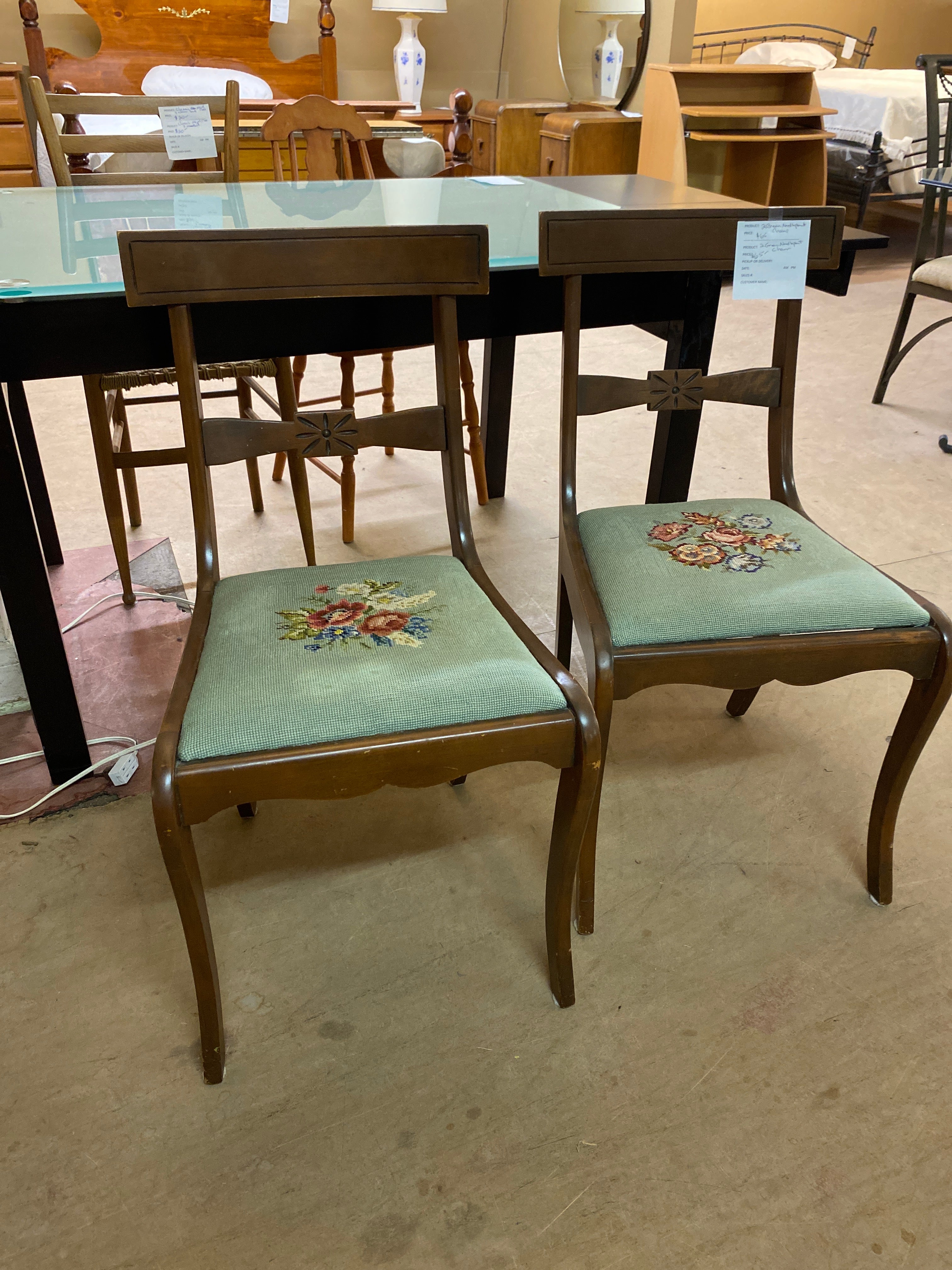 2 green needle point chairs